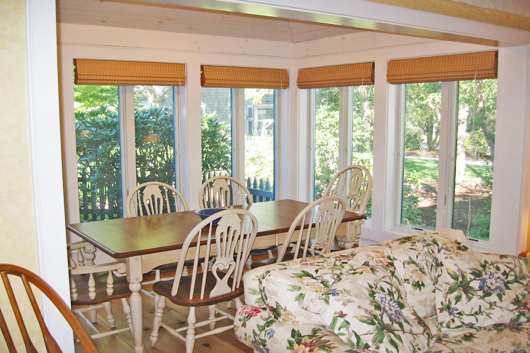 44 Brant Rock Road Mashpee, MA 02649 - Photo 5 of 22 a view of a dining room with furniture large windows and wooden floor