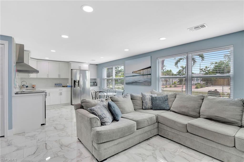 1009 Ridge Street Naples, FL 34103 - Photo 12 of 30 Living area with recessed lighting and light marble finish floors