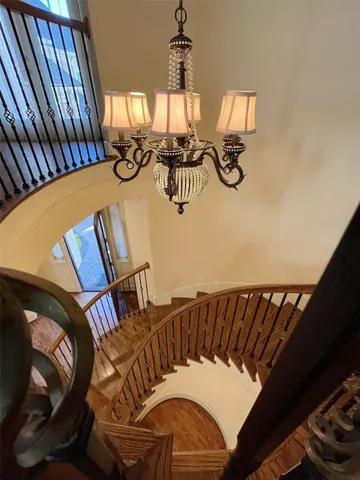 a view of a dining room with furniture and chandelier