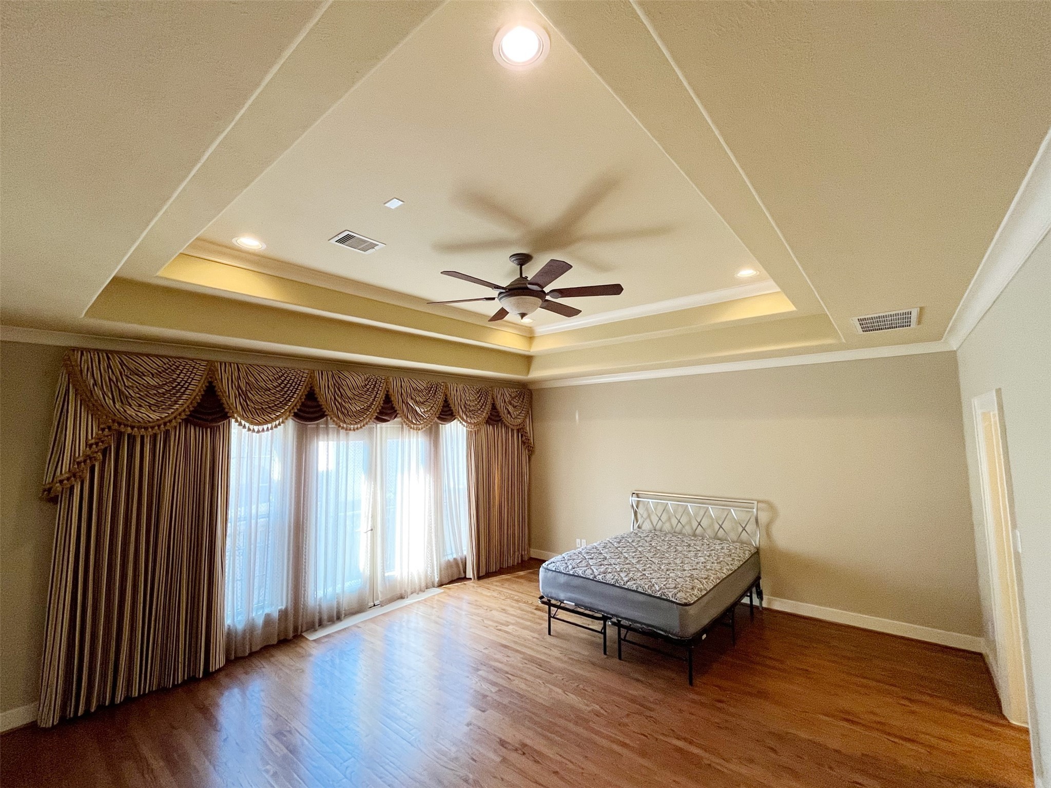 5455 Hidalgo Street Houston, TX 77056 - Photo 15 of 22 a view of a room with wooden floor and window