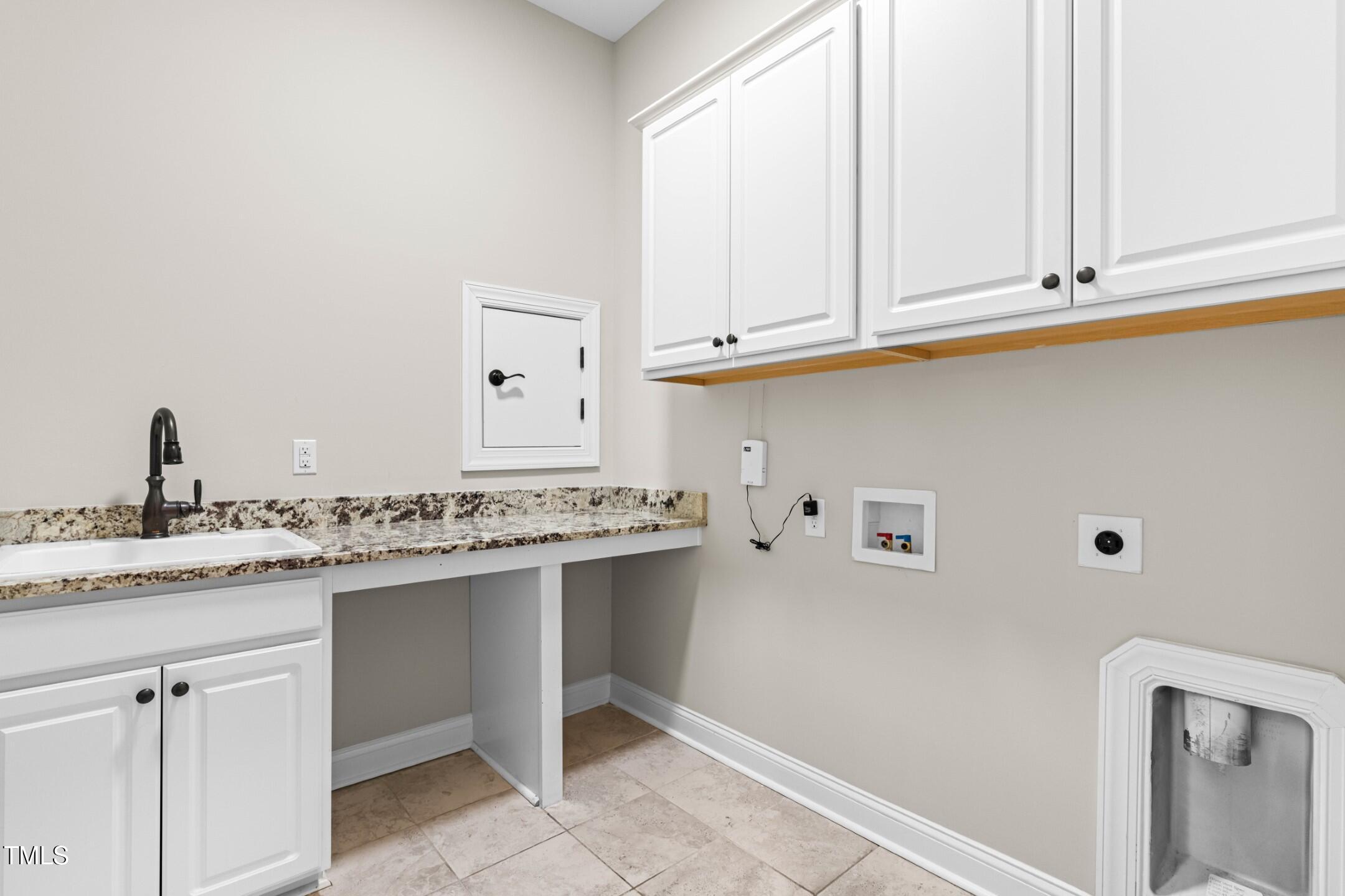128 Damsire Way Cary, NC 27513 - Photo 12 of 45 a kitchen with a sink and cabinets