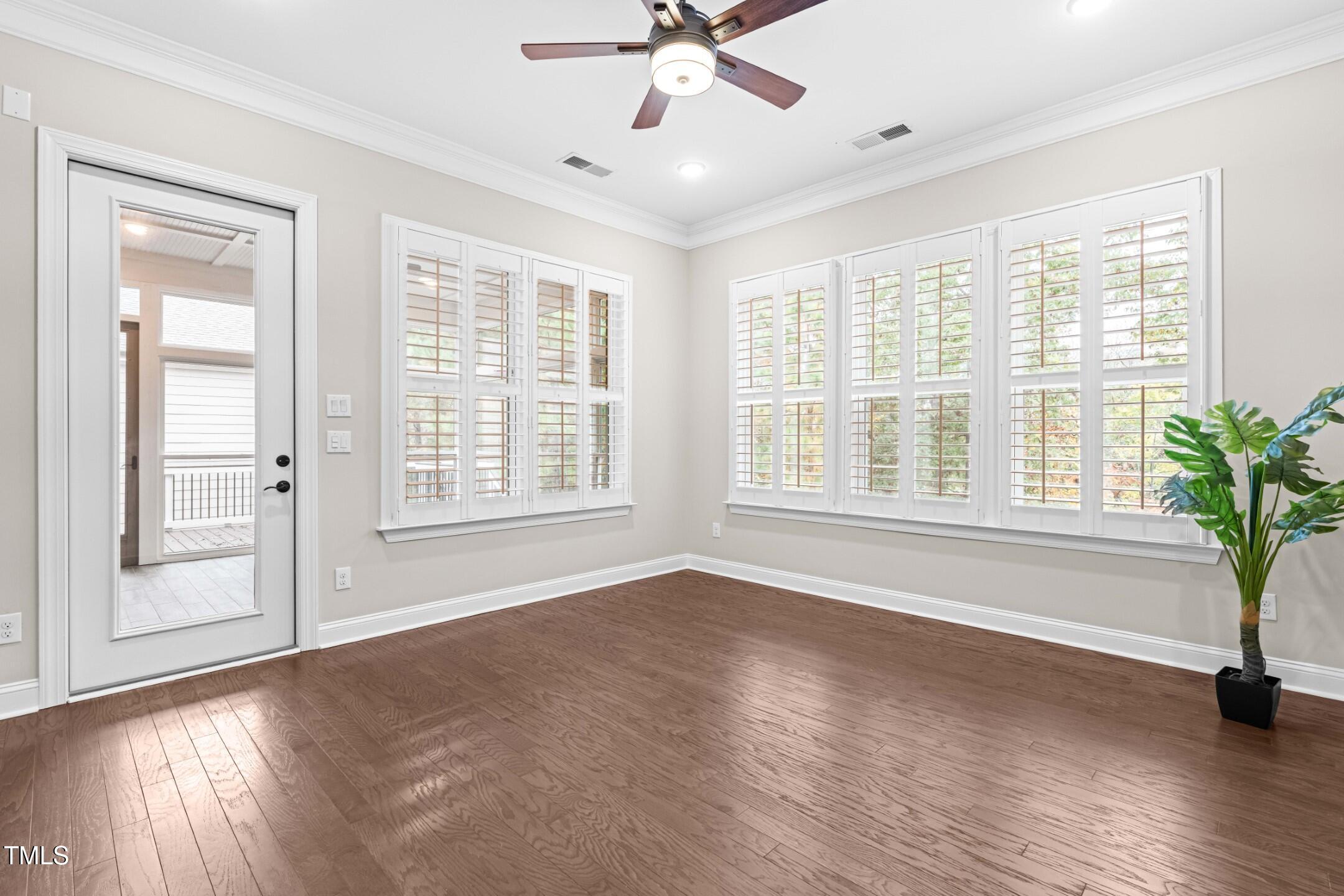 128 Damsire Way Cary, NC 27513 - Photo 21 of 45 a view of an empty room with a window and wooden floor