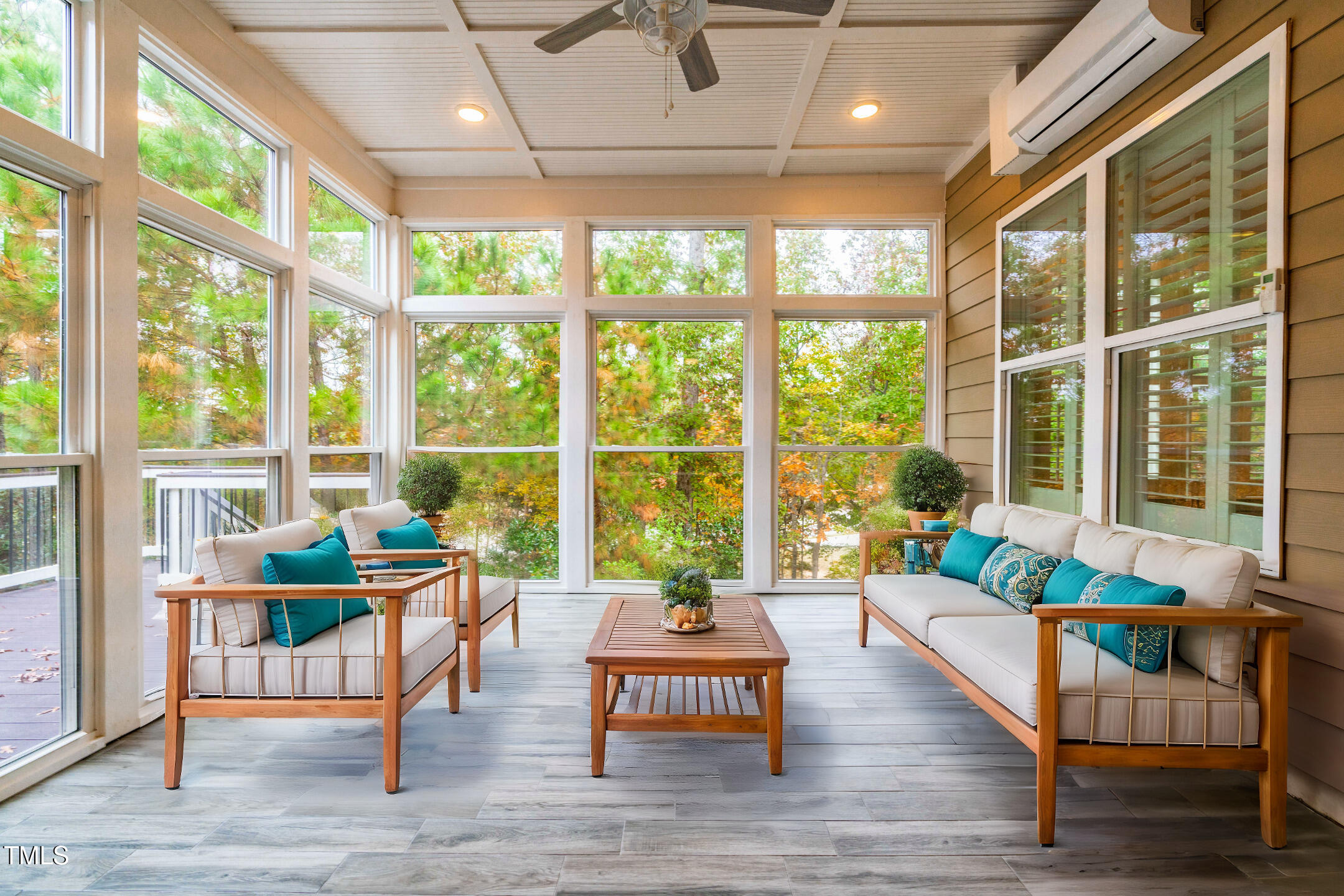 128 Damsire Way Cary, NC 27513 - Photo 22 of 45 a living room with furniture and floor to ceiling windows