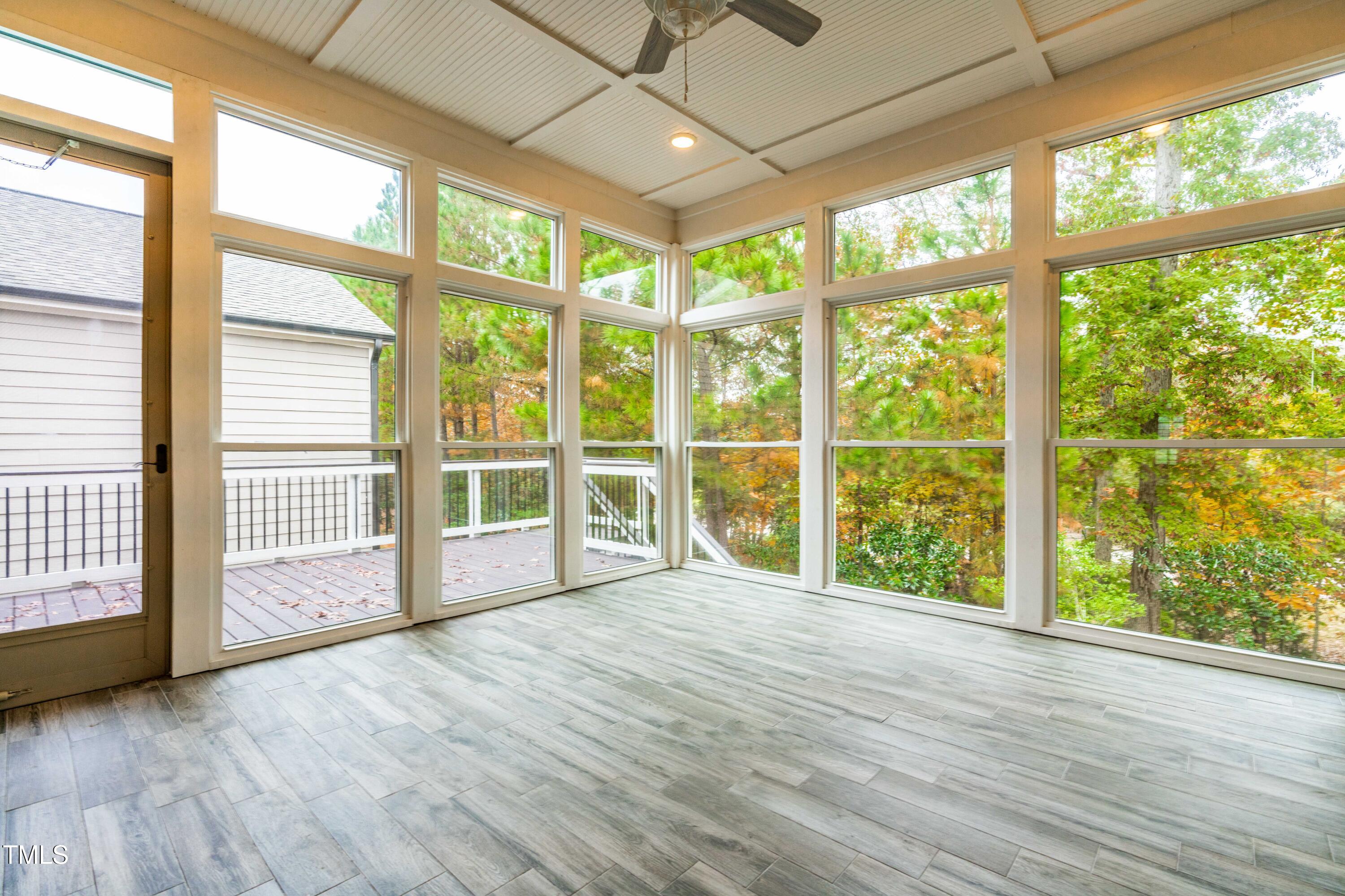 128 Damsire Way Cary, NC 27513 - Photo 24 of 45 a view of an empty room with wooden floor and a window