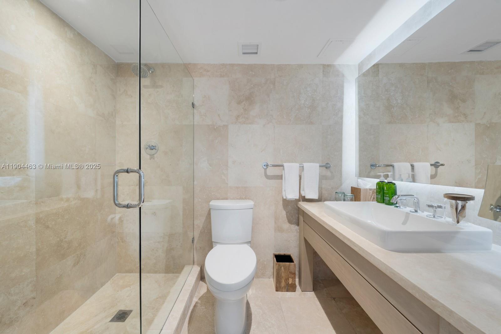 102 24th Street, Unit 1519 Miami Beach, FL 33139 - Photo 12 of 35 a bathroom with a sink toilet and shower