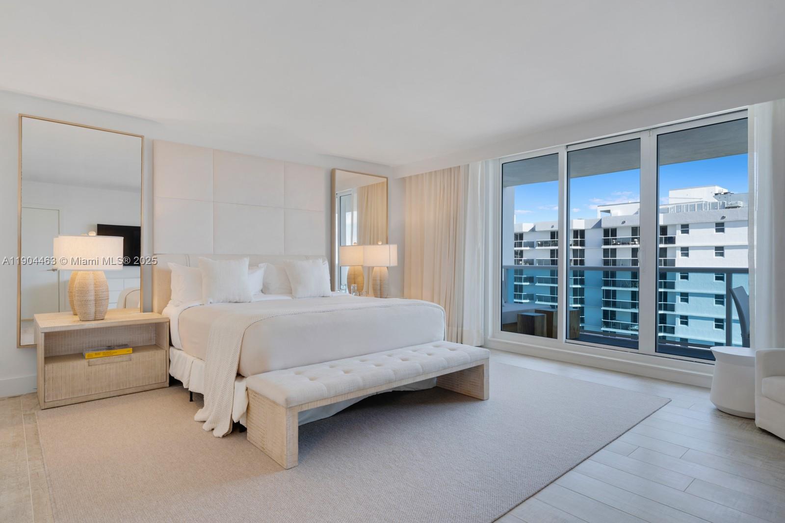 102 24th Street, Unit 1519 Miami Beach, FL 33139 - Photo 14 of 35 a spacious bedroom with a large bed and a view of walk in closet