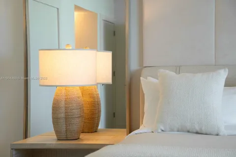 a view of walk in closet with clothes