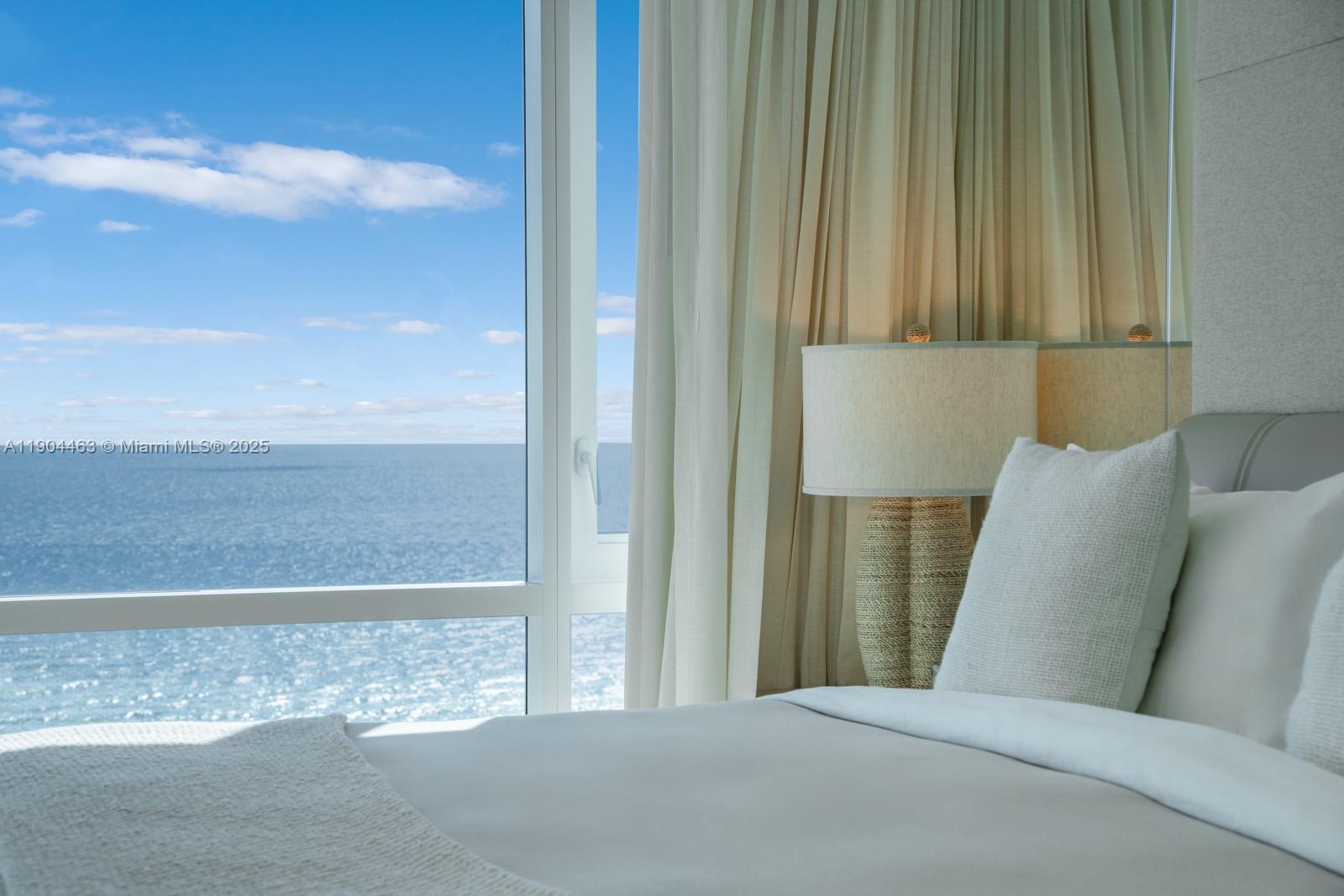 102 24th Street, Unit 1519 Miami Beach, FL 33139 - Photo 2 of 35 a living room with furniture and a rug