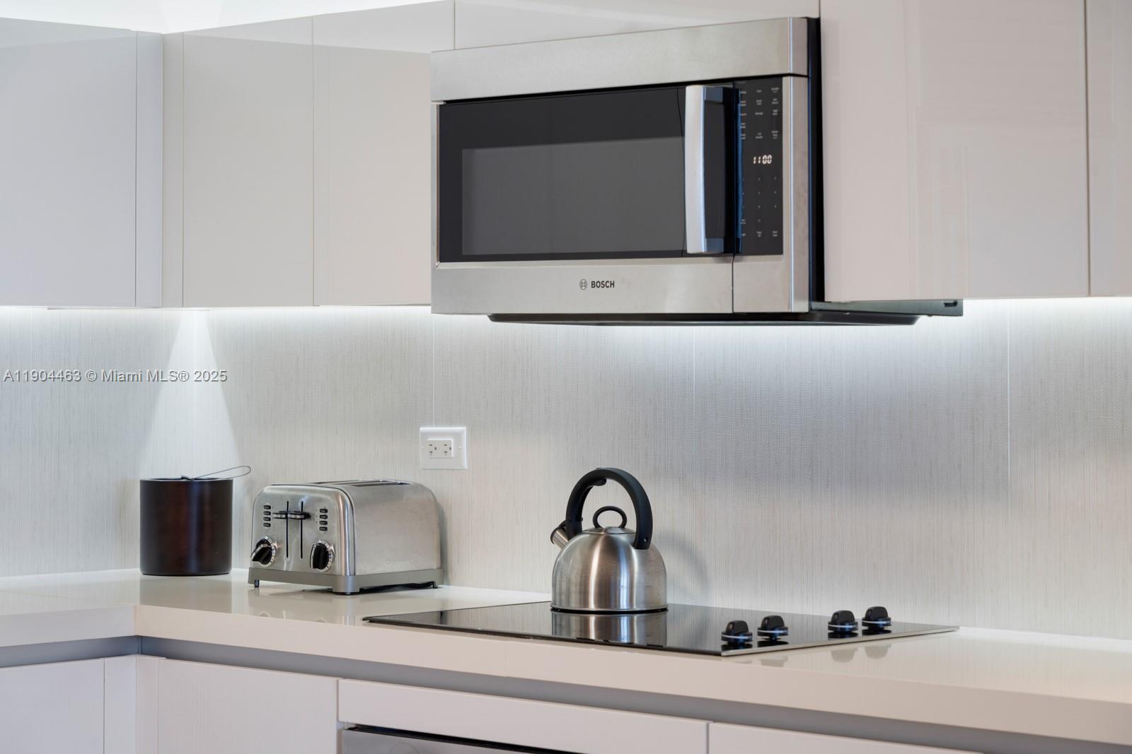 102 24th Street, Unit 1519 Miami Beach, FL 33139 - Photo 21 of 35 a bathroom with a sink and a mirror