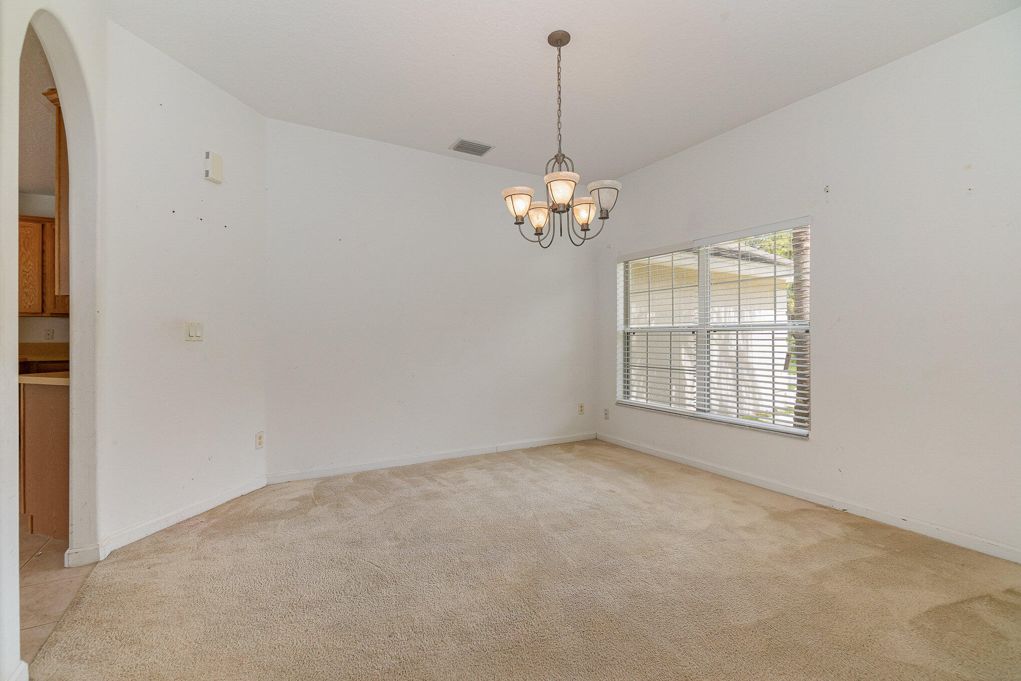 1088 Tupelo Road Southwest Palm Bay, FL 32908 - Photo 12 of 21 a view of an empty room with windows