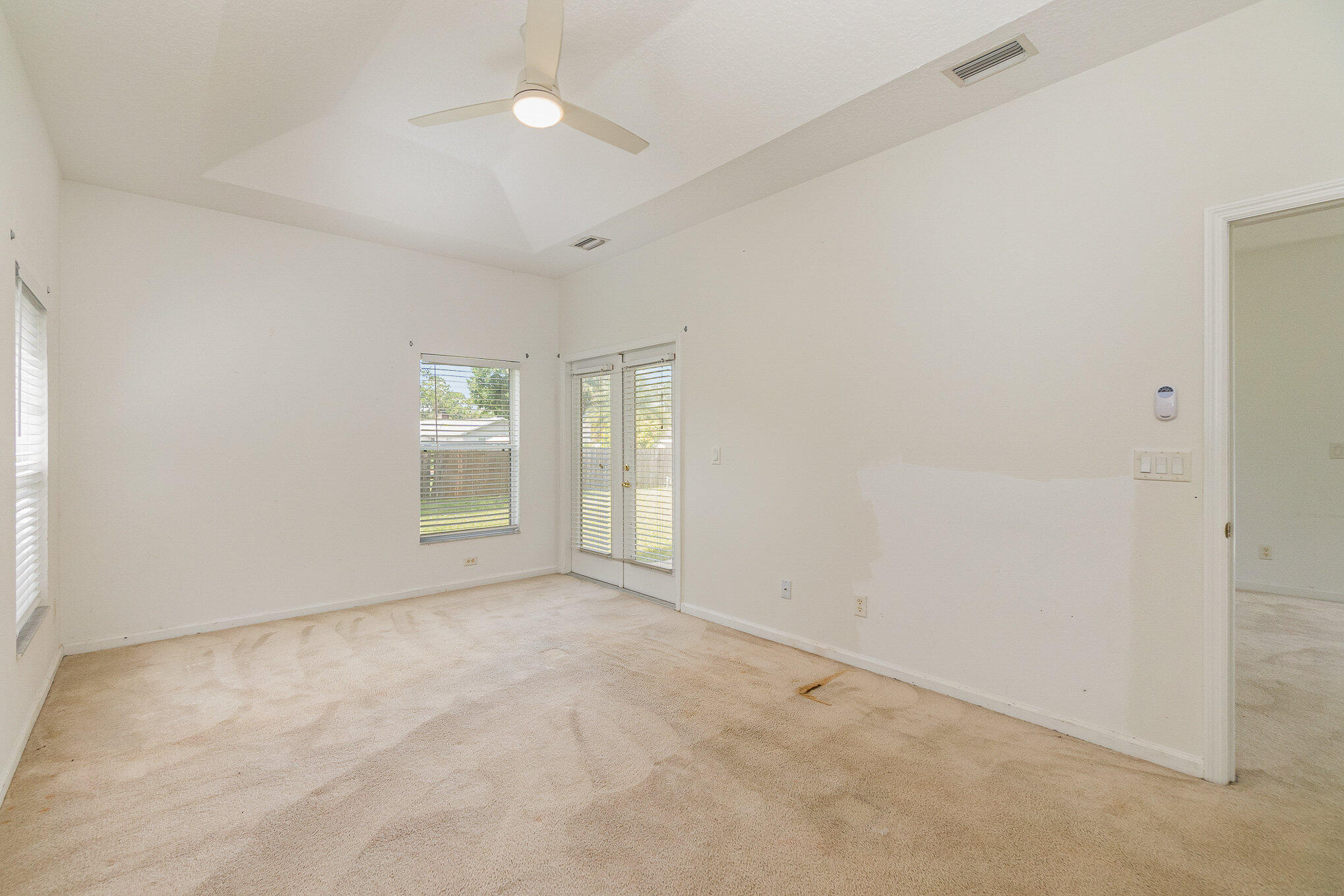 1088 Tupelo Road Southwest Palm Bay, FL 32908 - Photo 14 of 21 an empty room with windows