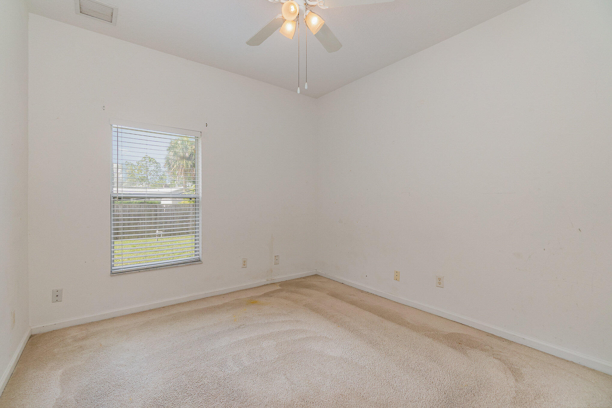1088 Tupelo Road Southwest Palm Bay, FL 32908 - Photo 17 of 21 an empty room with a window