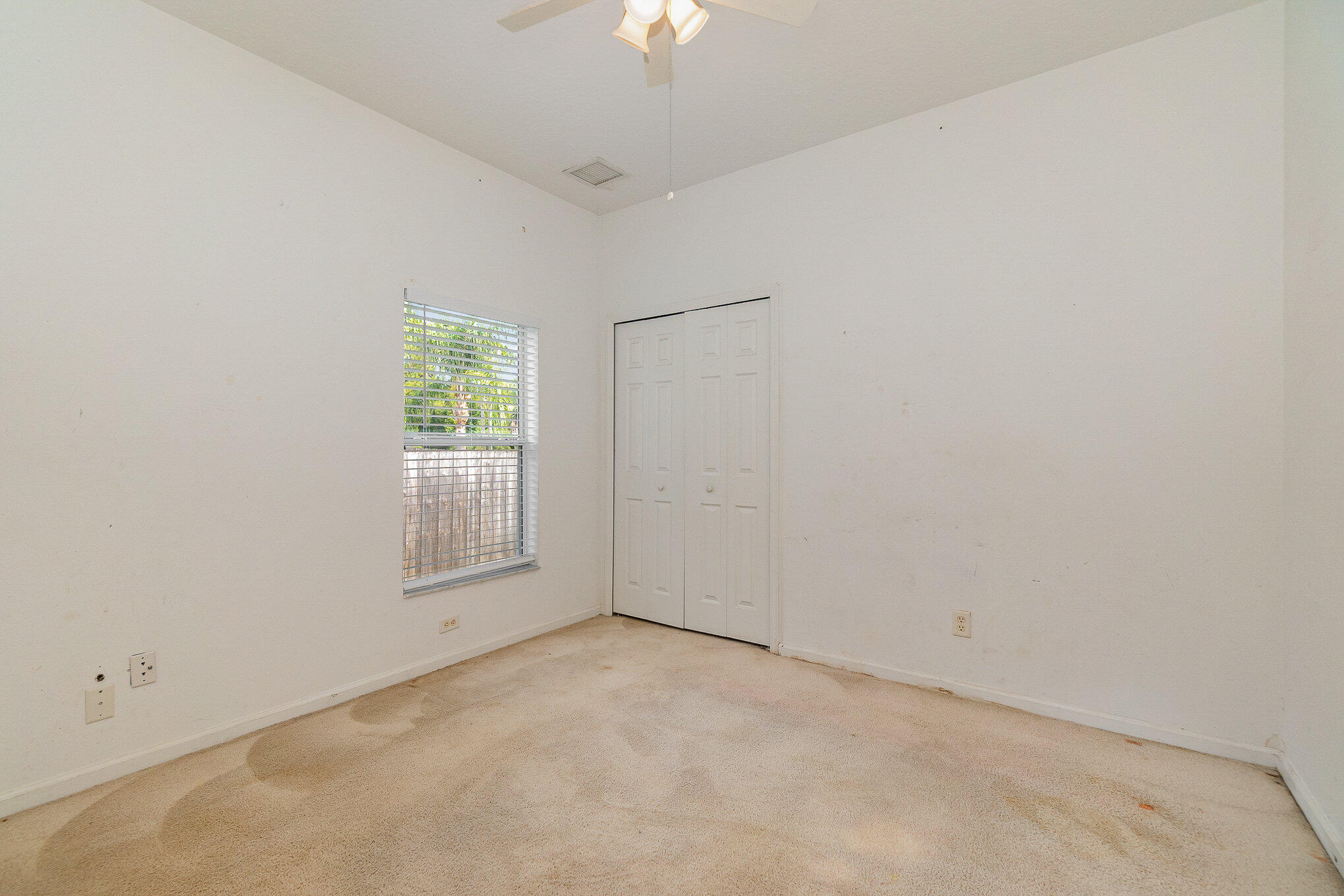 1088 Tupelo Road Southwest Palm Bay, FL 32908 - Photo 18 of 21 an empty room with a empty space and a window
