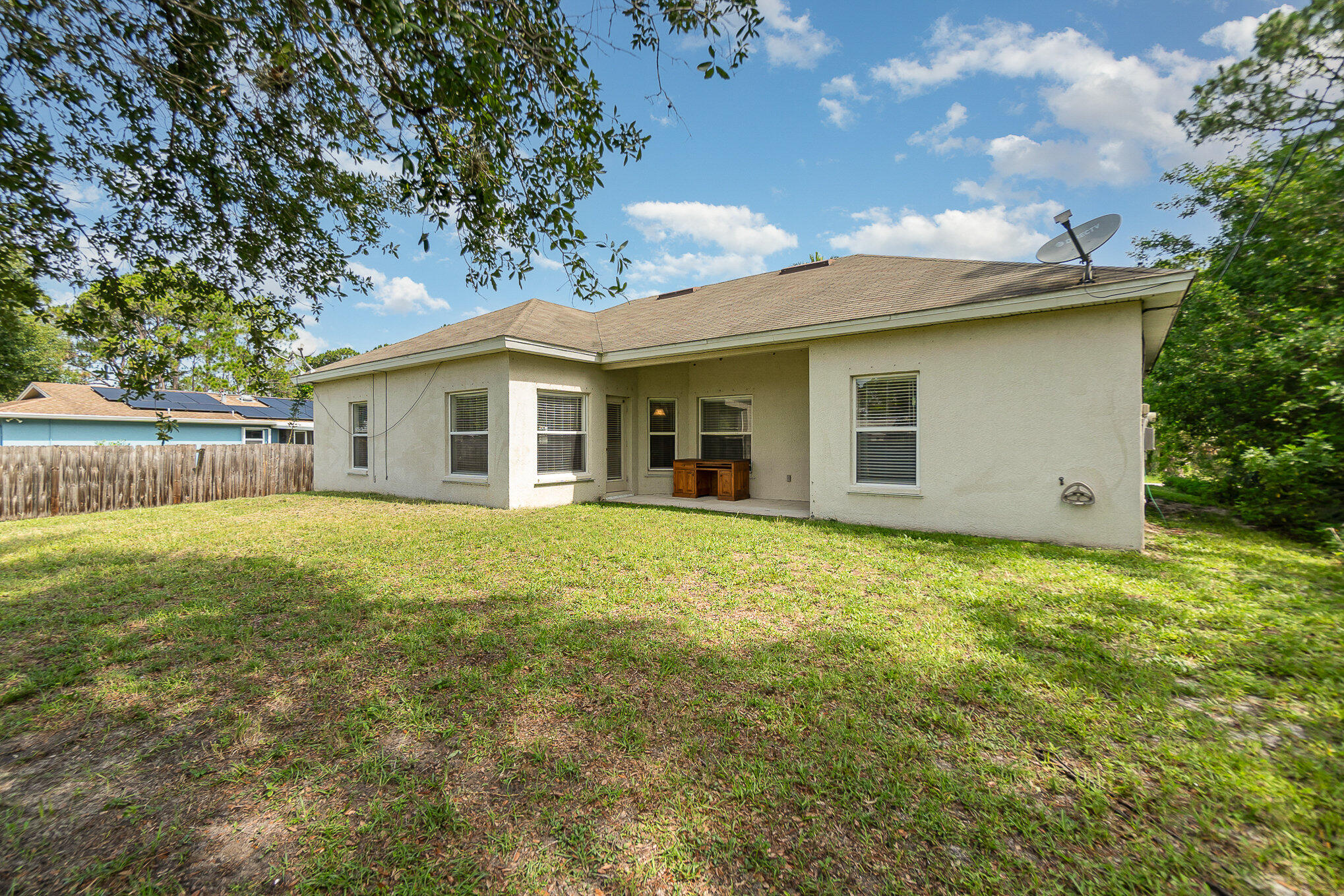 1088 Tupelo Road Southwest Palm Bay, FL 32908 - Photo 20 of 21 a view of a house with a backyard