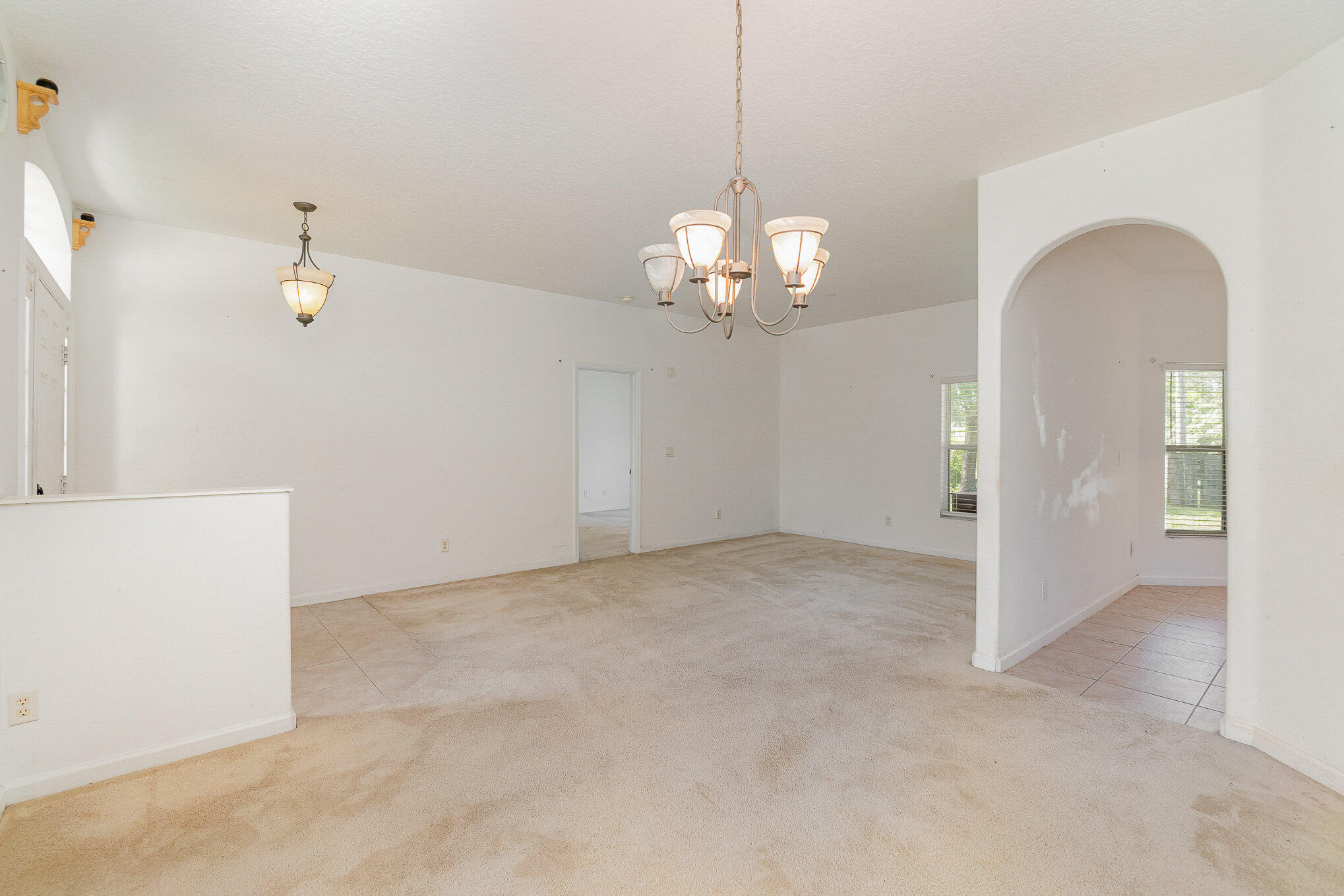 1088 Tupelo Road Southwest Palm Bay, FL 32908 - Photo 4 of 21 a view of a livingroom with chandelier