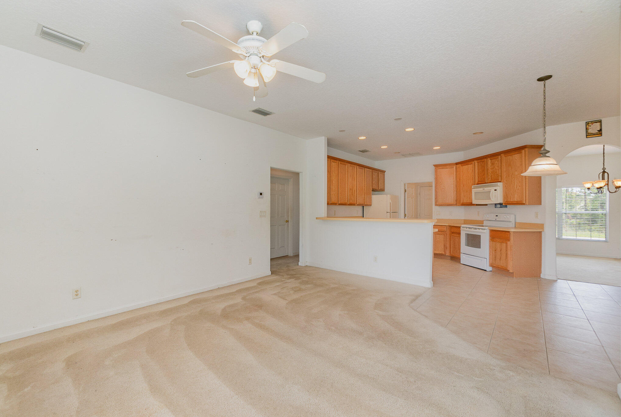 1088 Tupelo Road Southwest Palm Bay, FL 32908 - Photo 6 of 21 a view of a kitchen with a sink and a window