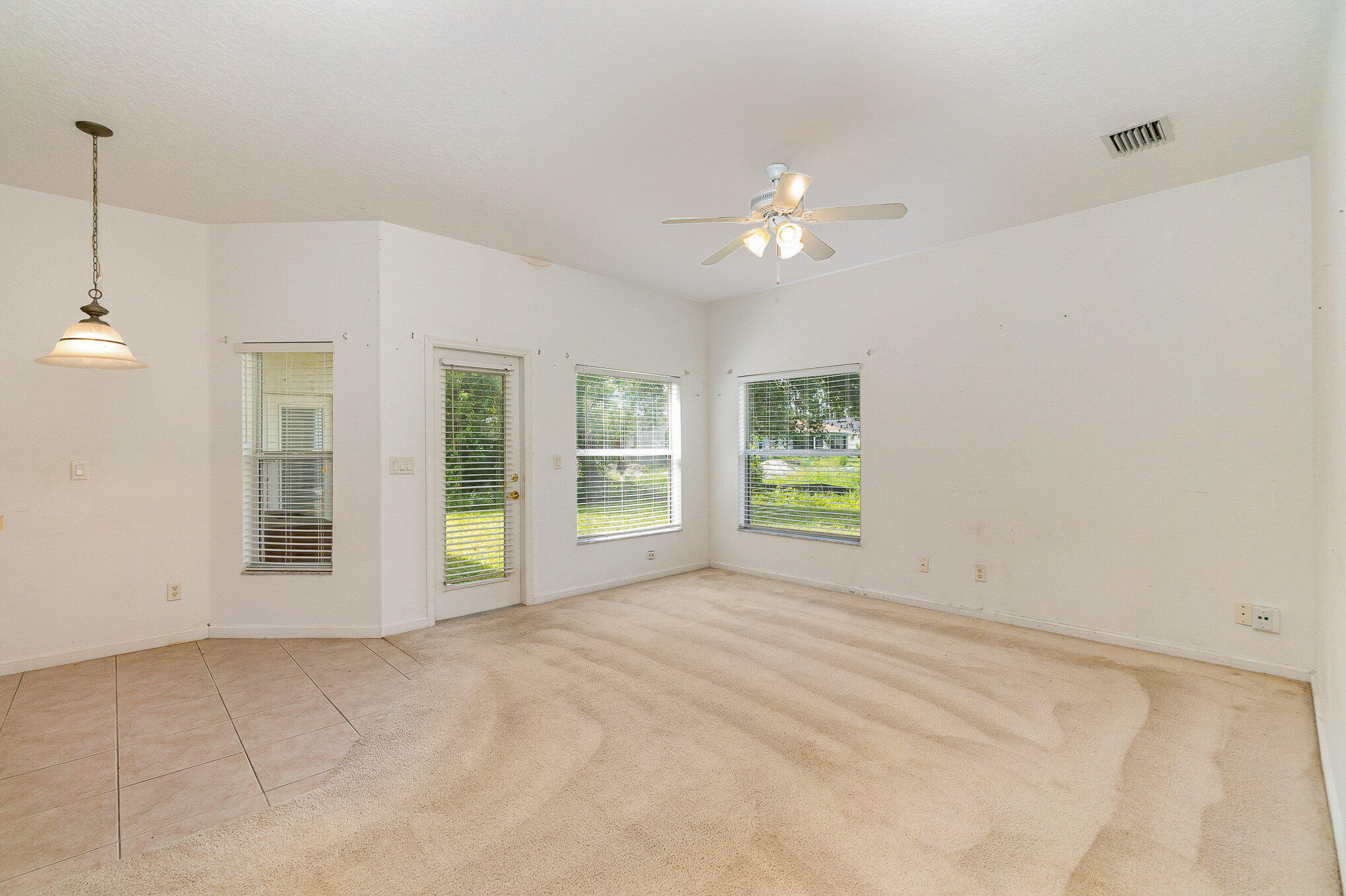 1088 Tupelo Road Southwest Palm Bay, FL 32908 - Photo 8 of 21 a view of an empty room with a window