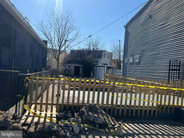 a view of a brick house with a yard