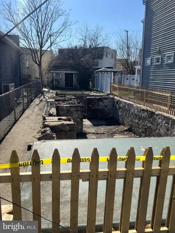 a view of swimming pool with a yard