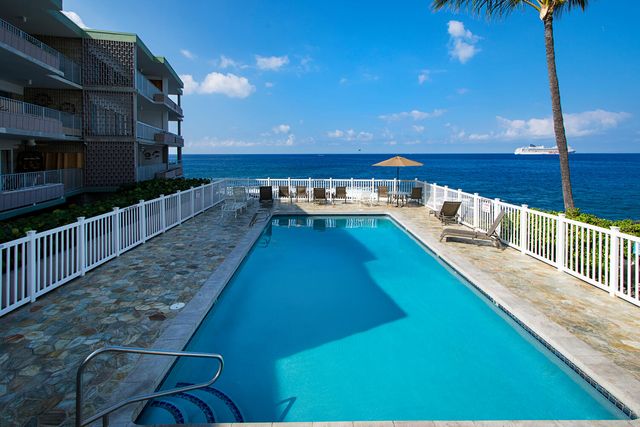 a view of a balcony with chairs