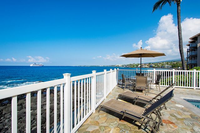 a view of balcony with wooden floor