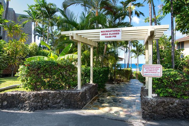a view of sign board with a house
