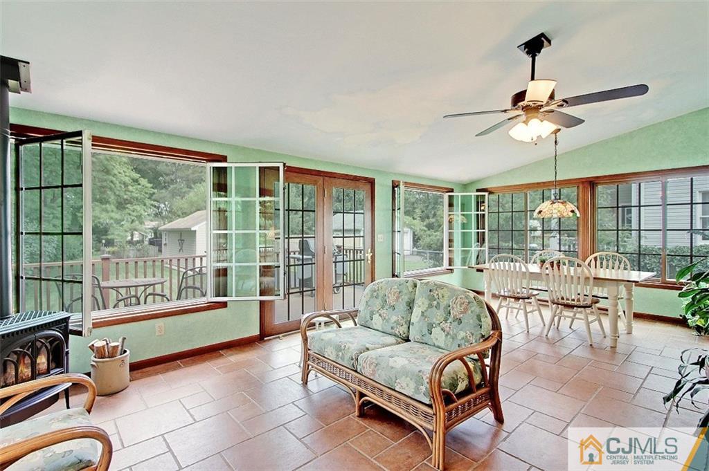188 Stout Avenue Middlesex, NJ 08846 - Photo 2 of 25 a living room with furniture and a floor to ceiling window