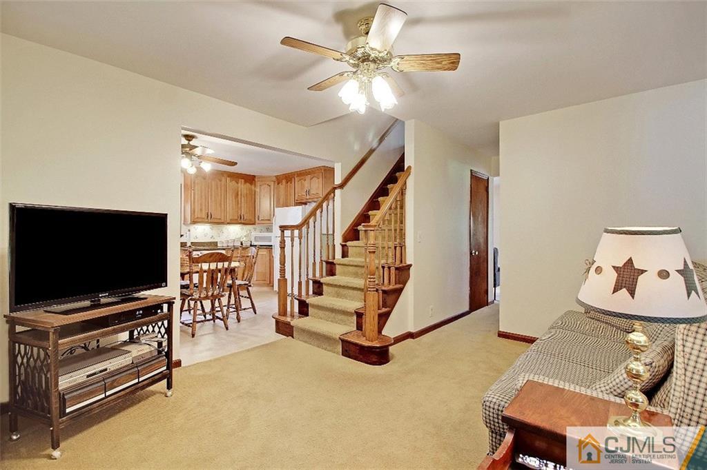 188 Stout Avenue Middlesex, NJ 08846 - Photo 12 of 25 a living room with furniture and a flat screen tv
