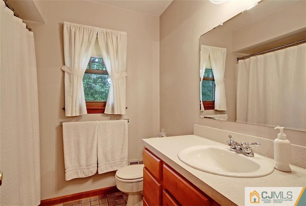 188 Stout Avenue Middlesex, NJ 08846 - Photo 13 of 25 a bathroom with a sink toilet and shower