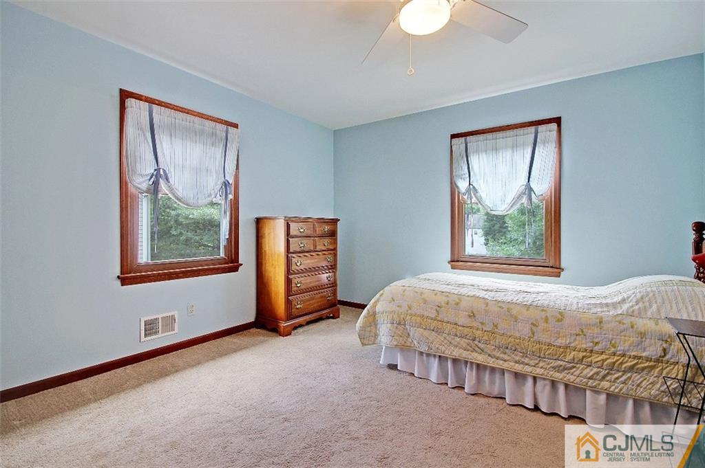188 Stout Avenue Middlesex, NJ 08846 - Photo 15 of 25 a bed sitting in a bedroom next to a window