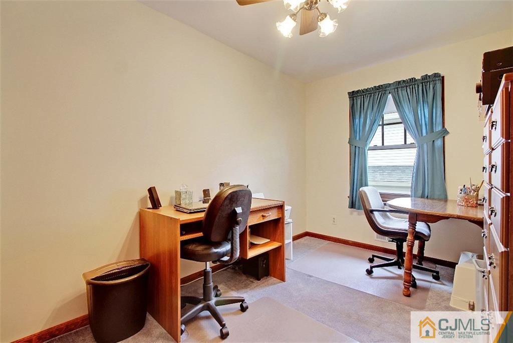 188 Stout Avenue Middlesex, NJ 08846 - Photo 16 of 25 a view of a workspace with furniture and a window