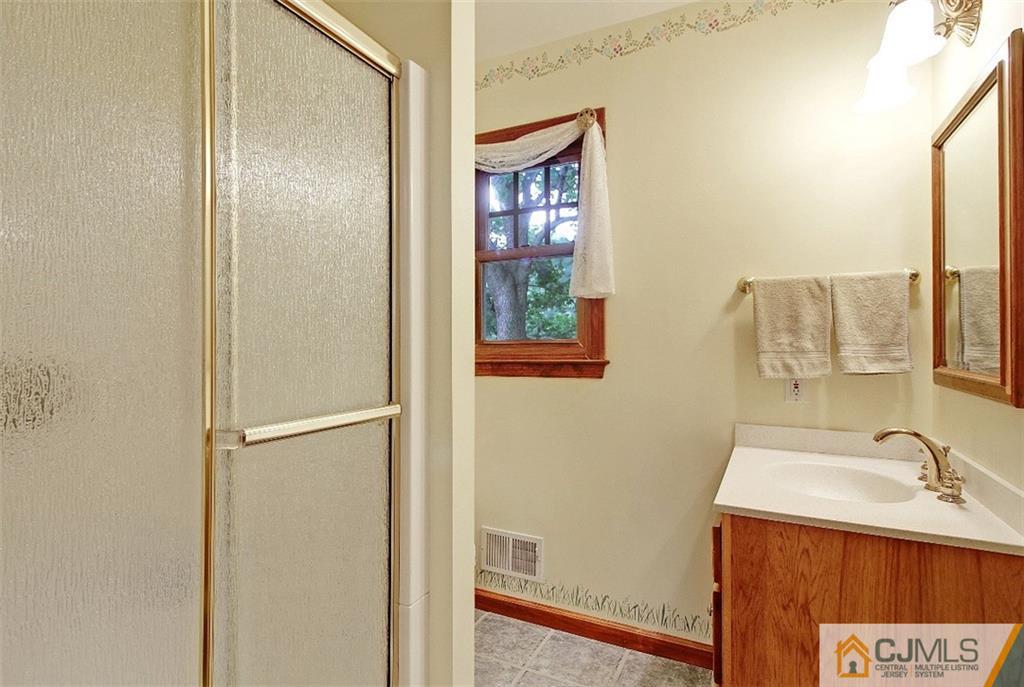 188 Stout Avenue Middlesex, NJ 08846 - Photo 19 of 25 a bathroom with a sink and a mirror