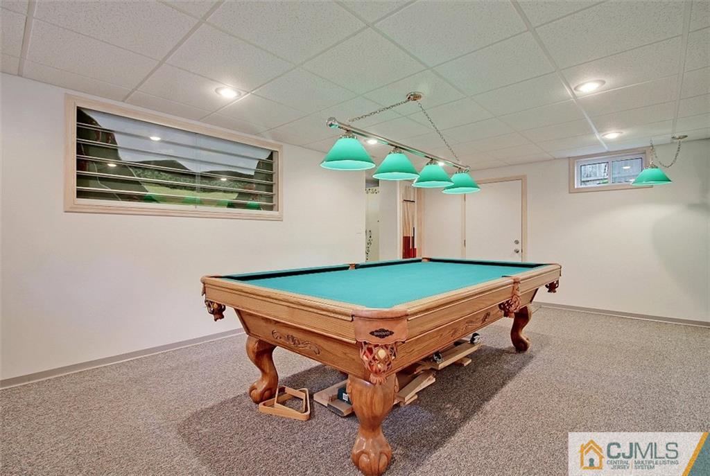 188 Stout Avenue Middlesex, NJ 08846 - Photo 20 of 25 a room with pool table and a chandelier