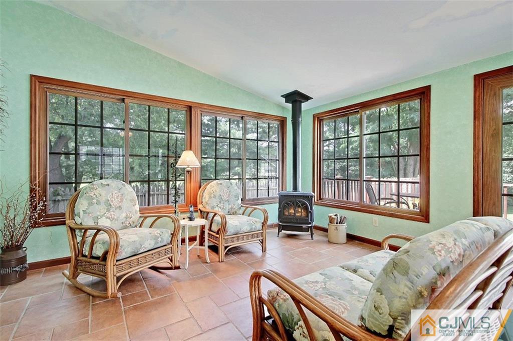 188 Stout Avenue Middlesex, NJ 08846 - Photo 4 of 25 a living room with furniture and floor to ceiling windows