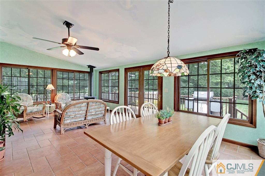 188 Stout Avenue Middlesex, NJ 08846 - Photo 7 of 25 a dining room with furniture a chandelier and wooden floor