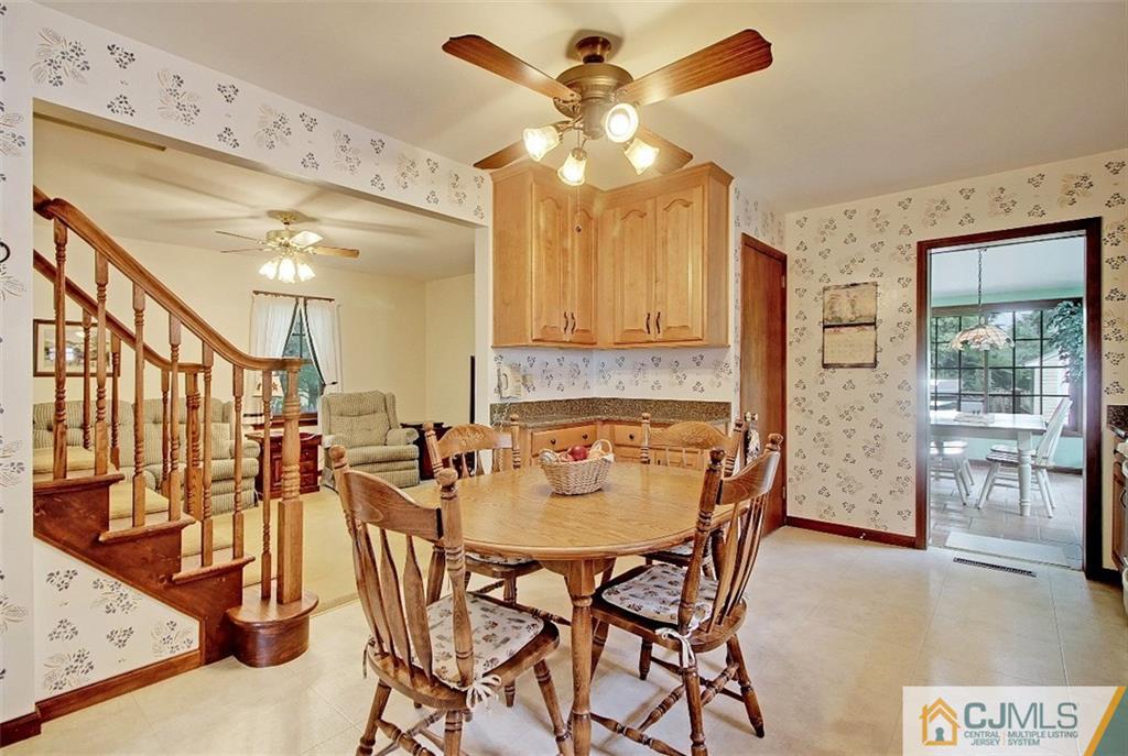 188 Stout Avenue Middlesex, NJ 08846 - Photo 8 of 25 a dining room with furniture and a chandelier