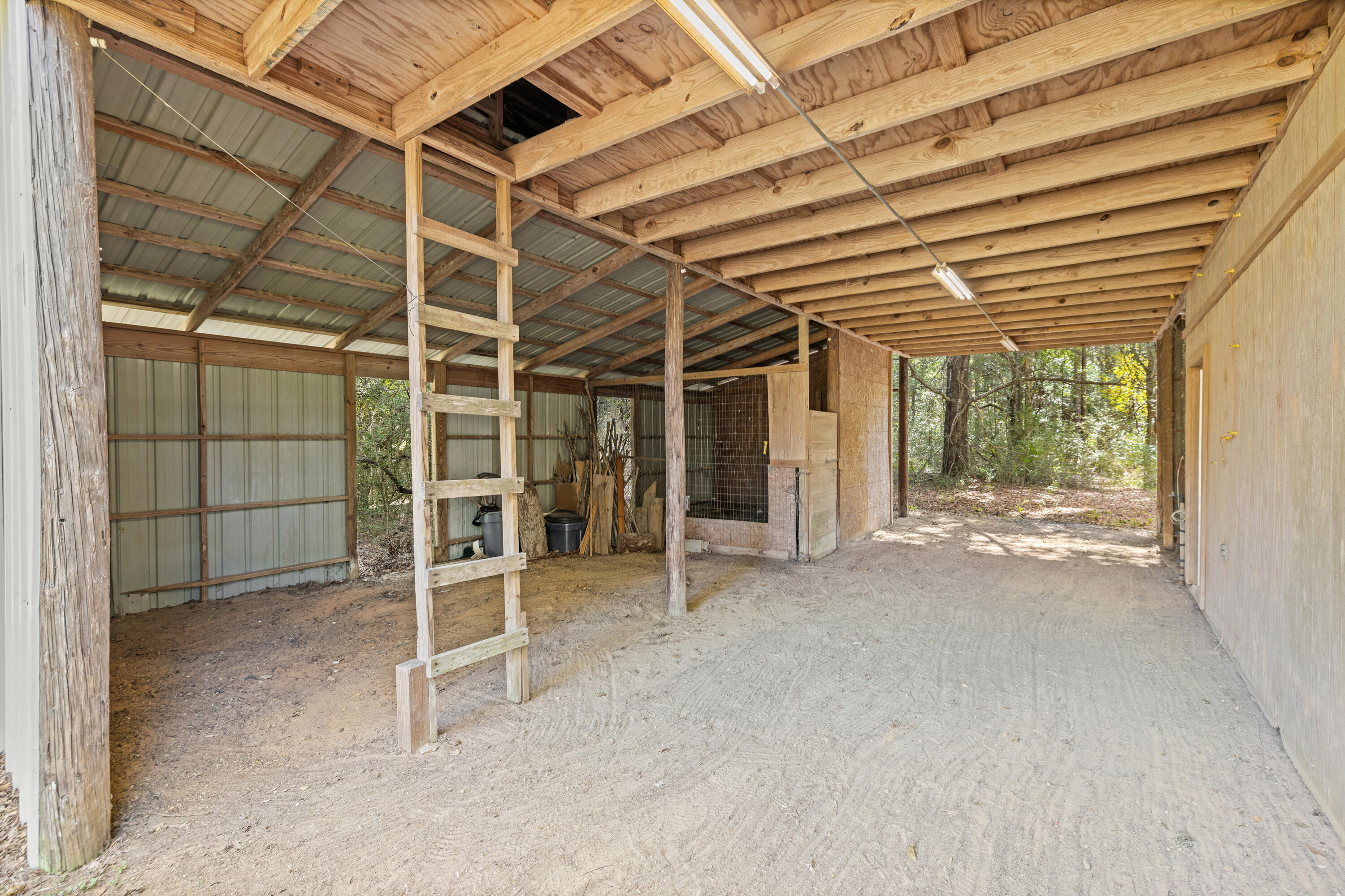 1287 Adams Road DeFuniak Springs, FL 32433 - Photo 54 of 67 a view of a room with wooden walls