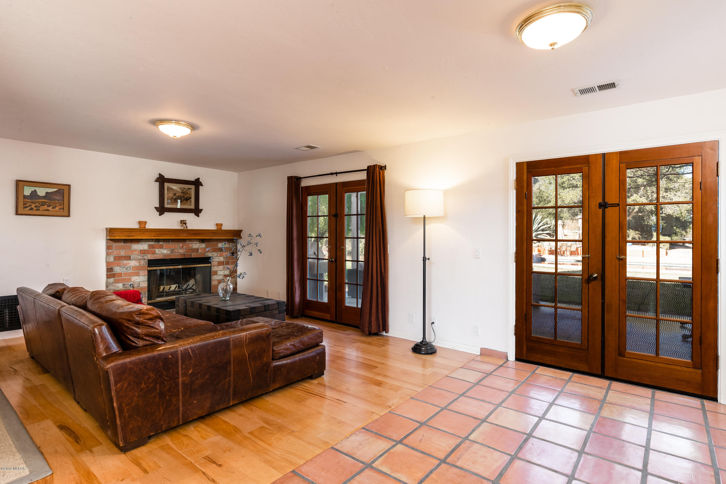 2096 Still Meadow Road Solvang, CA 93463 - Photo 8 of 25 a living room with furniture a fireplace and a large window