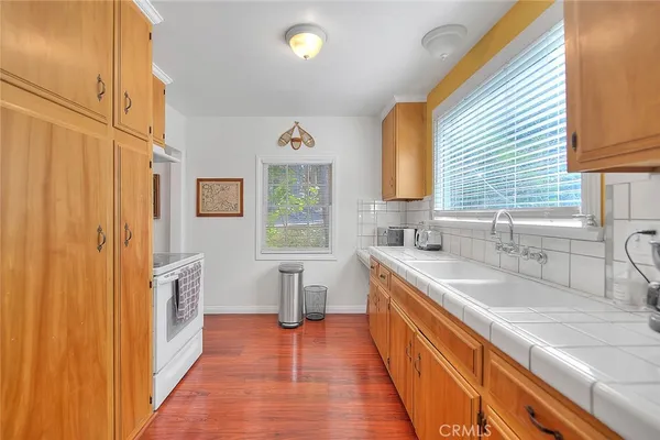 a bathroom with a sink a mirror and a shower