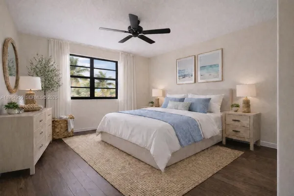 a bedroom with a large bed and a window