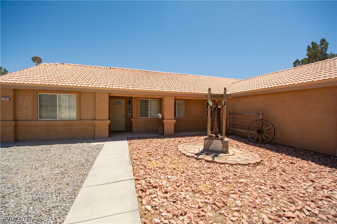 2381 Tough Boy Road Pahrump, NV 89060 - Photo 4 of 44 This desert dwelling offers a unique exterior with a distinct architectural style.
