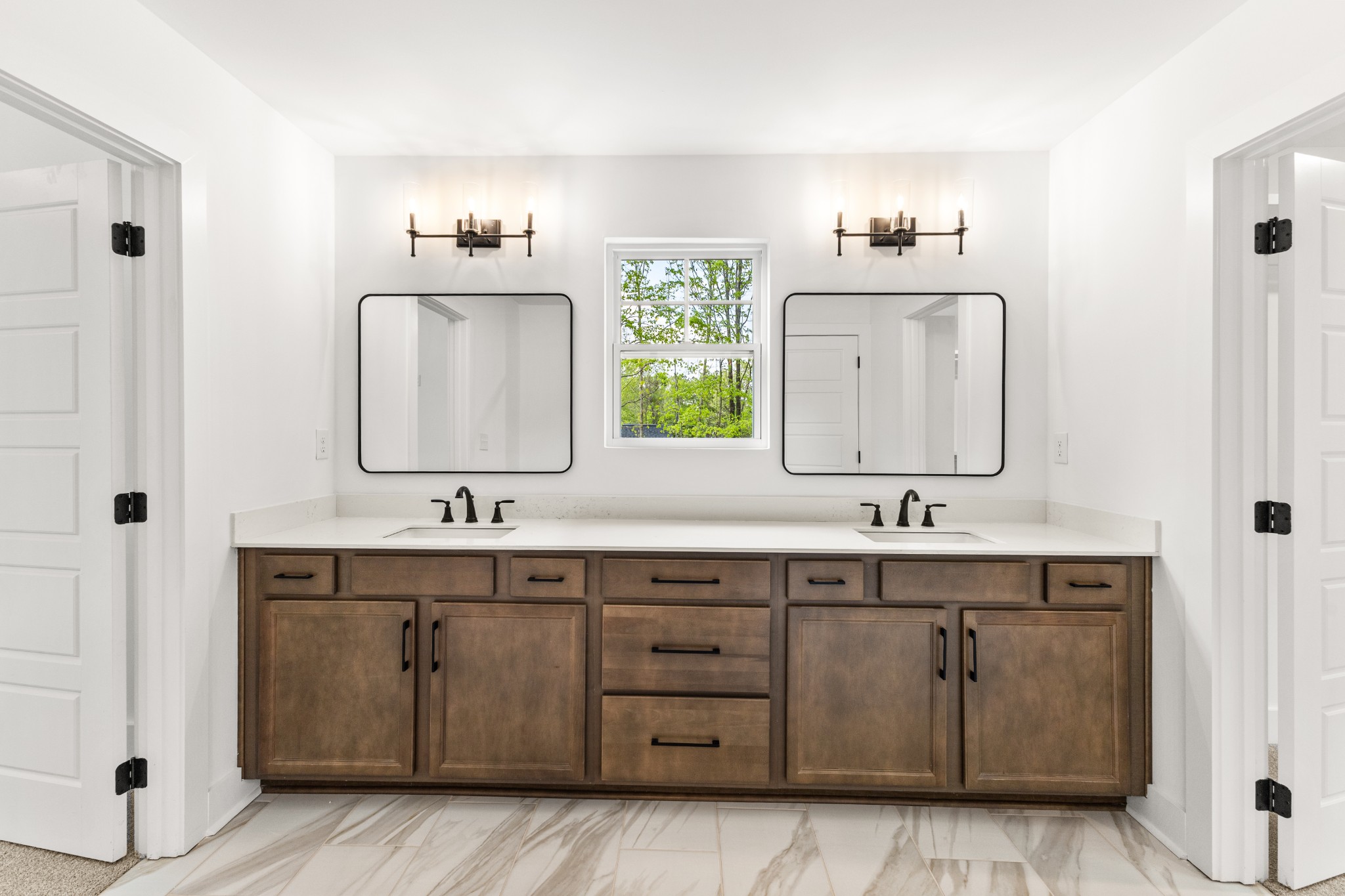 1013 Walnut Grove Road Dickson, TN 37055 - Photo 15 of 38 a bathroom with a double vanity sink and mirror
