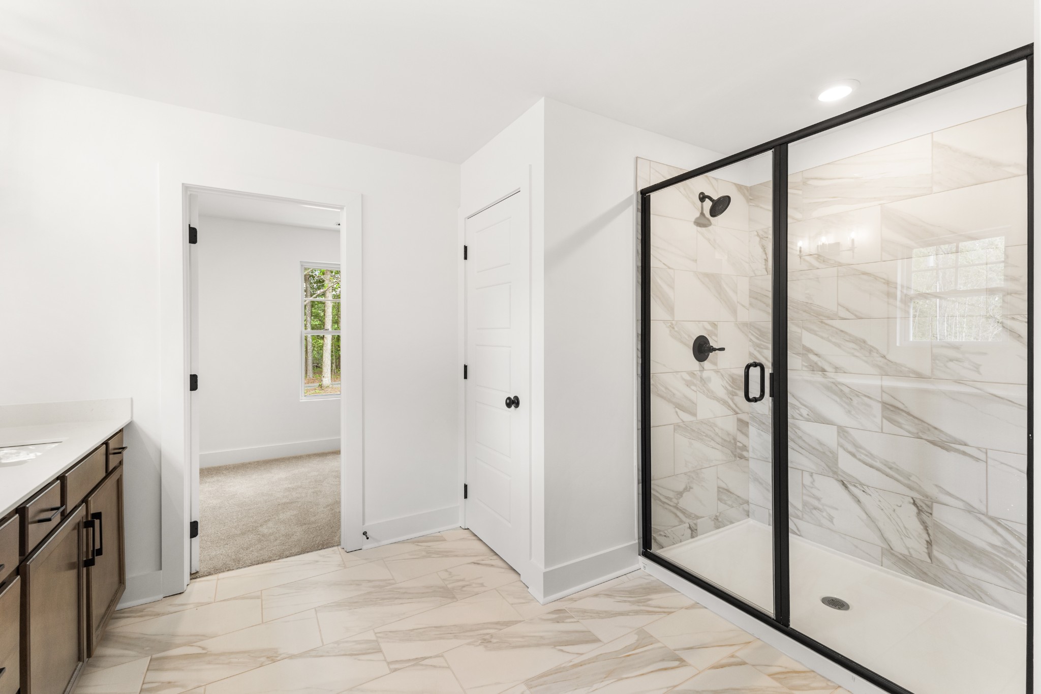 1013 Walnut Grove Road Dickson, TN 37055 - Photo 16 of 38 a bathroom with a glass shower door and a bathtub
