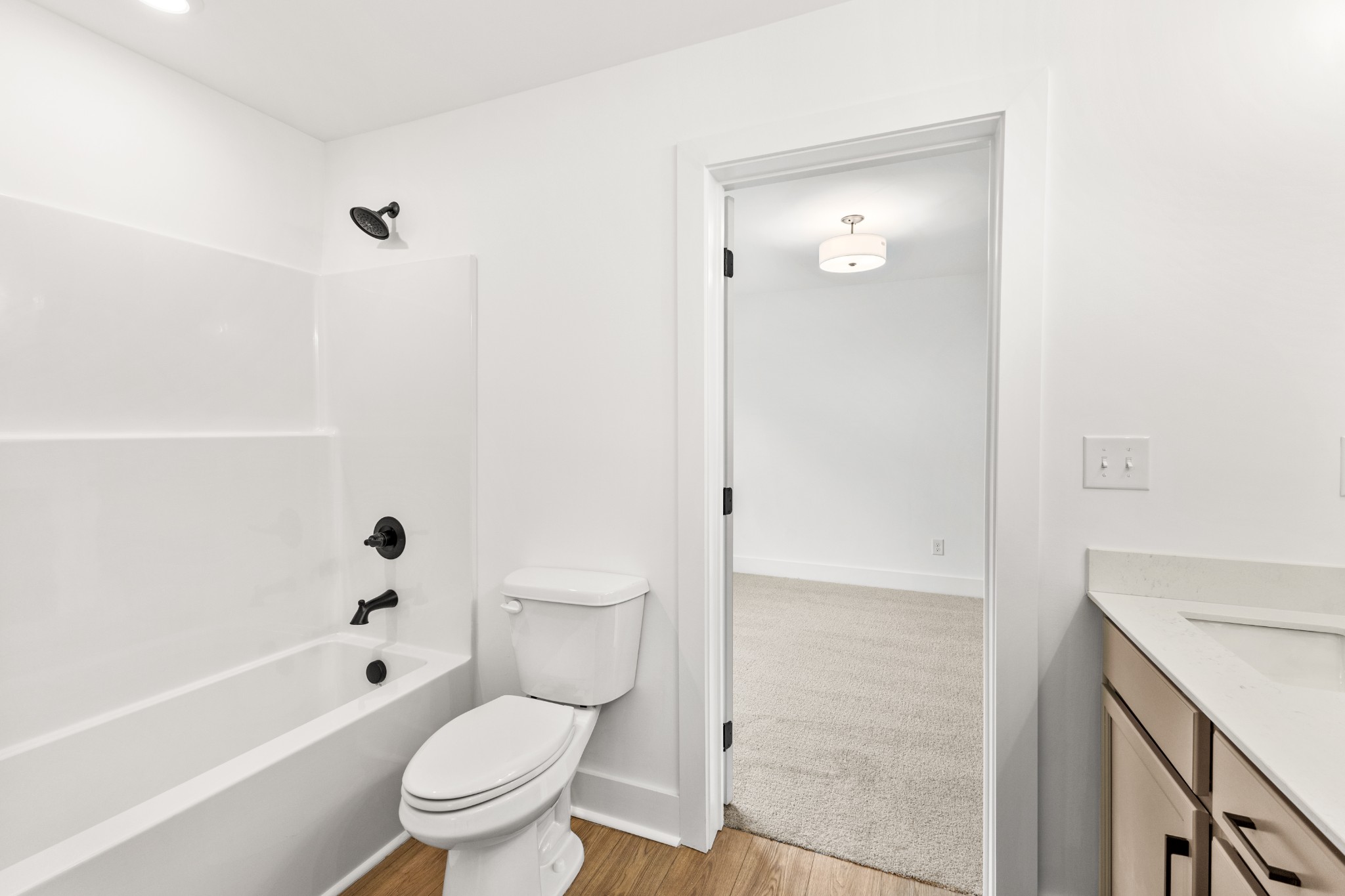 1013 Walnut Grove Road Dickson, TN 37055 - Photo 22 of 38 a bathroom with a toilet a sink and bathtub