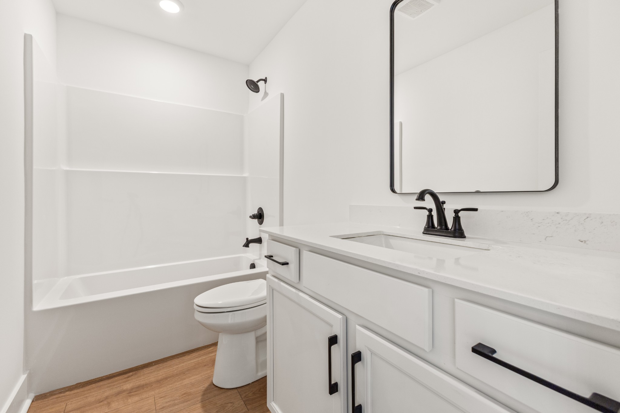 1013 Walnut Grove Road Dickson, TN 37055 - Photo 27 of 38 a bathroom with a sink a toilet and a mirror