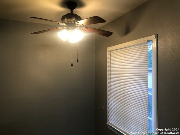 a view of a livingroom and window
