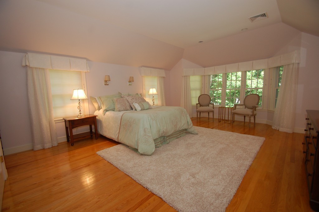 20 Northgate Road Wellesley, MA 02481 - Photo 10 of 24 a spacious bedroom with a bed and large windows