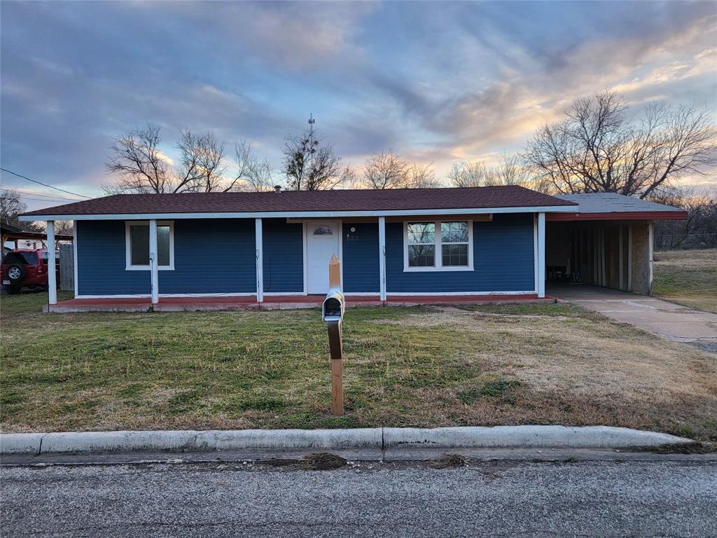 623 West Mesquite Street Jacksboro, TX 76458 - Photo 24 of 25 a front view of a house with garden