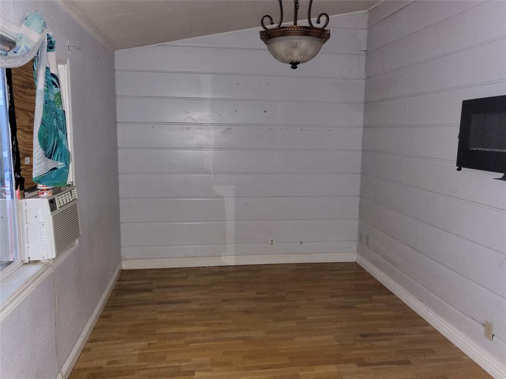 623 West Mesquite Street Jacksboro, TX 76458 - Photo 8 of 25 a view of a room with racks on the wall