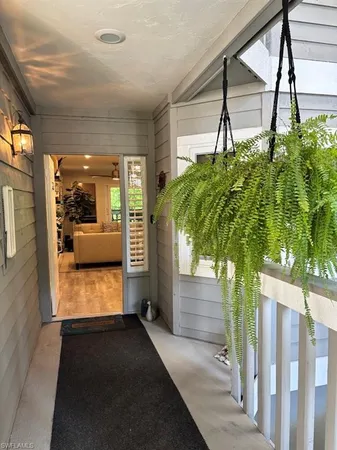 a view of hallway with seating space